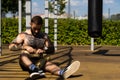 portrait of a man doing sports on the street with sports machine Royalty Free Stock Photo