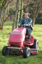 Portrait man driving mower Royalty Free Stock Photo