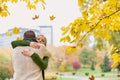 Portrait of man embracing his beautiful wife in park