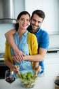 Portrait of man embracing woman in the kitchen