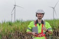 portrait man engineer worker thumbs up holding laptop at wind turbine field renewable energy. technology protect environment Royalty Free Stock Photo