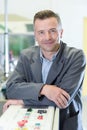portrait man in factory leaning on control panel Royalty Free Stock Photo