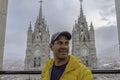 portrait of a man in front of the basilica of the national vote ecuador