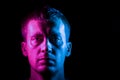 Portrait of man in full face illuminated with pink and blue Royalty Free Stock Photo