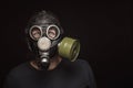 Portrait of man in gas mask with furious eyes, copy space Royalty Free Stock Photo
