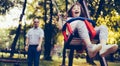 Portrait of man and girl with down syndrome swinging Royalty Free Stock Photo