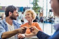 Portrait of man giving passport to passenger service agent to get his boarding pass in airport Royalty Free Stock Photo