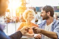 Portrait of man giving passport to passenger service agent to get his boarding pass in airport Royalty Free Stock Photo