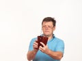 Portrait of a man in glasses on a white background with a phone Royalty Free Stock Photo