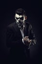 Portrait of man with Halloween skull makeup on the black backgro Royalty Free Stock Photo