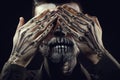 Portrait of man with Halloween skull makeup on the black backgro Royalty Free Stock Photo