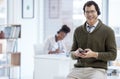 Portrait, man and happy with smartphone at call center for customer or client support and service. Office, crm and Royalty Free Stock Photo