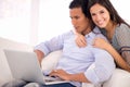 Portrait, man and happy woman on sofa with laptop for internet, browse and search for movie subscription. Relax, smile Royalty Free Stock Photo