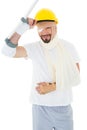 Portrait of a man in hard hat with broken hand and crutch Royalty Free Stock Photo