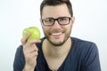 Portrait of a man holding an apple