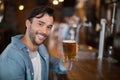 Portrait of man holding beer glass at pub Royalty Free Stock Photo