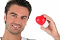 Portrait of a man holding a heart Royalty Free Stock Photo