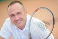 Portrait man holding tennis racket Royalty Free Stock Photo