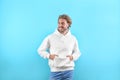 Portrait of man in hoodie sweater on color background Royalty Free Stock Photo