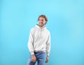 Portrait of man in hoodie sweater on color background Royalty Free Stock Photo