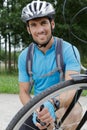Portrait man inflating bicycle tyre Royalty Free Stock Photo