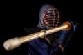 Portrait of man kendo fighter with bokuto