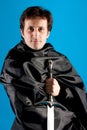 Portrait of man with a knight sword Royalty Free Stock Photo