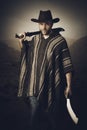 portrait of man with leather hat and machete Royalty Free Stock Photo