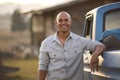 Portrait Of Man Loading Backpack Into Pick Up Truck For Road Trip To Cabin In Countryside Royalty Free Stock Photo