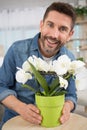 portrait man with lowering houseplant Royalty Free Stock Photo