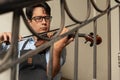 Man playing the violin inside a building Royalty Free Stock Photo