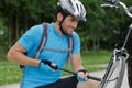 portrait man pumping bicycle wheel Royalty Free Stock Photo