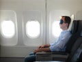 Portrait of man relaxing in the airplane Royalty Free Stock Photo