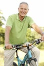 Portrait of man riding cycle in countryside Royalty Free Stock Photo