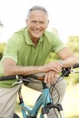 Portrait of man riding cycle in countryside Royalty Free Stock Photo