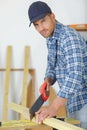 Portrait man sawing wood Royalty Free Stock Photo