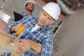 portrait man sawing wood Royalty Free Stock Photo