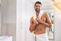 Portrait, man and smile with towel in bathroom for fresh hygiene, morning routine and healthy skincare. Happy, clean and Royalty Free Stock Photo