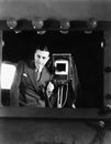 Portrait of a man standing with a large format camera Royalty Free Stock Photo