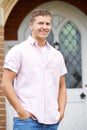 Portrait Of Man Standing Outside Front Door Of Home Royalty Free Stock Photo