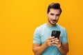 Portrait man studio cyberspace phone phone yellow smartphone smiling mobile happy copy space communication Royalty Free Stock Photo