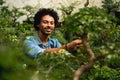 Portrait of man taking care of plants in the garden Royalty Free Stock Photo