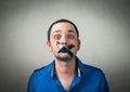 Portrait of man with taped mouth Royalty Free Stock Photo