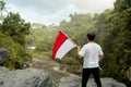 Asian male with indonesian flag celebrating independence day Royalty Free Stock Photo