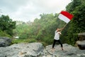 Asian male with indonesian flag celebrating independence day