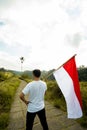 Asian male with indonesian flag celebrating independence day