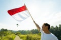 Asian male with indonesian flag celebrating independence day