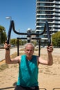 portrait of a man training his body on the street with sports machine Royalty Free Stock Photo