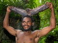 Portrait of a man of the tribe Yaffi after hunting flying foxes. New Guinea Island