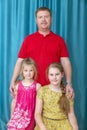 portrait of a man with two blonde daughters Royalty Free Stock Photo